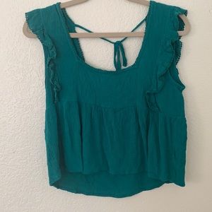 Turquoise tank top! Worn once, shrunk in dryer! Make sure to air dry!